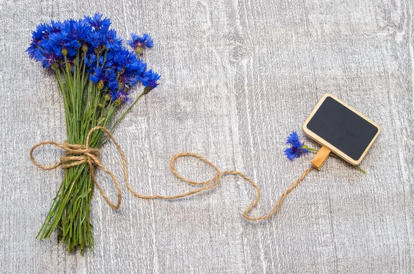 Strauß Kornblumen und Etikett für Text. — Stockfoto