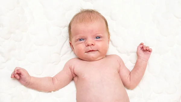 Newborn baby portrait with funny face expression — Stock Photo, Image