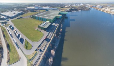 Krefeld, Germany - February 15, 2017 : Thyssenkrupp is shipping their products from the turnaround harbour of Krefeld, Germany clipart