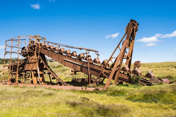 Abandoned dredge used to mine gold in the beginning of 20th century (1904-1910). It was brought by the English during the gold rush. Tierra del Fuego, Chile