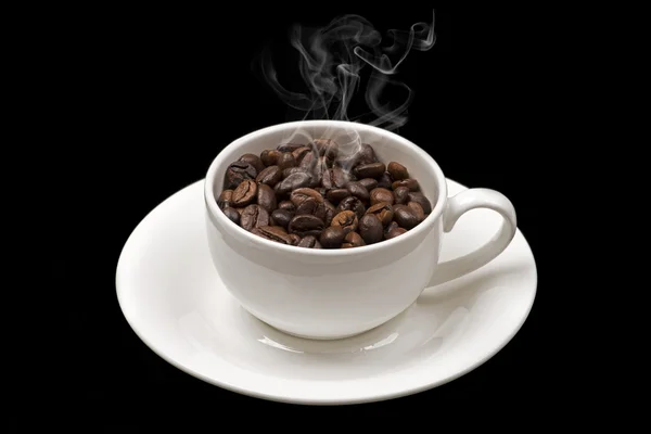 Caliente taza de granos de café Imagen de stock