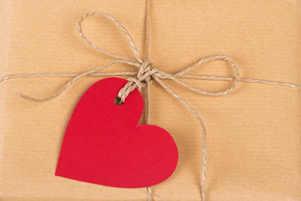 Gift box with heart-shaped labels — Stock Photo, Image