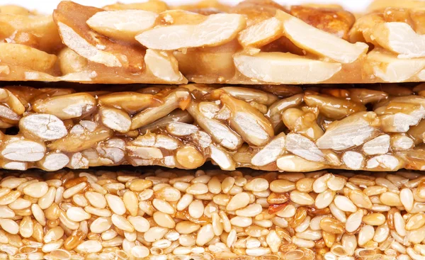 Honey bars with peanuts, sesame seeds and sunflower seeds — Stock Photo, Image