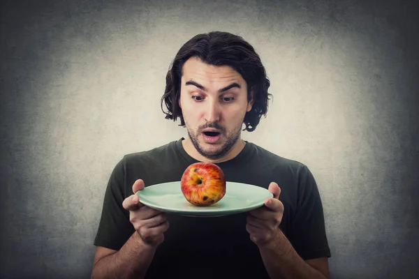 Shocked Person Holding Dish Plate Slightly Degraded Apple Rotten Fruit — Stock Photo, Image