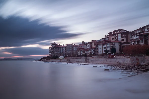 Sea sunset at the coastal city — Stock Photo, Image