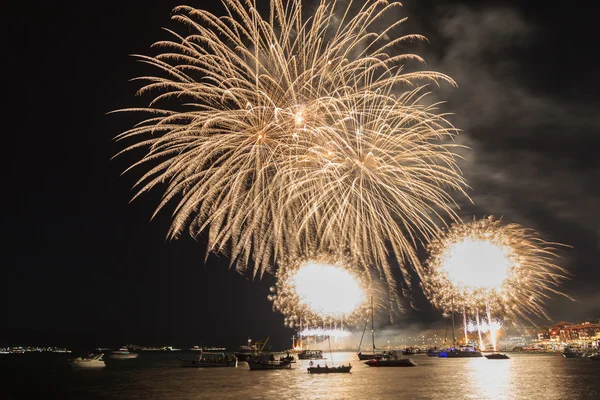 Fireworks over the sea town — Stock Photo, Image