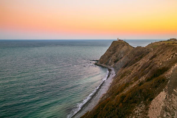 Rocky coast at sunset — Stock Photo, Image