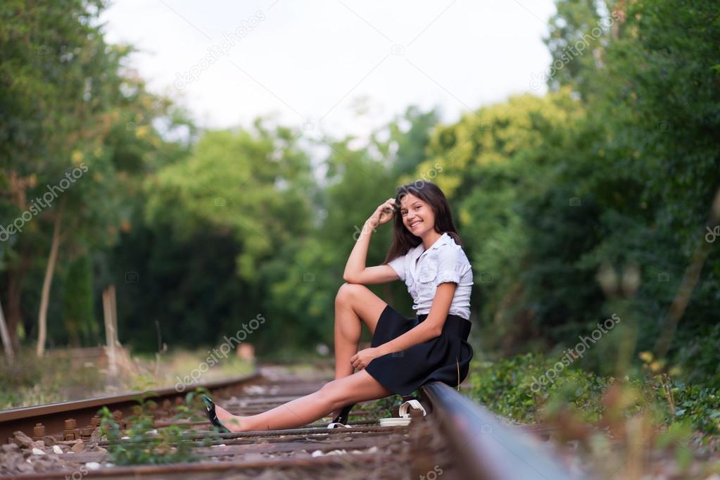 Depressed Young Man Sitting On Railway Track Stock Photo - Alamy