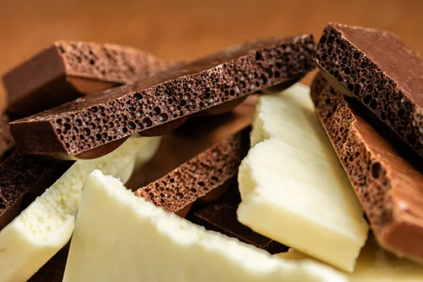 Sortimento poroso chocolate close-up — Fotografia de Stock