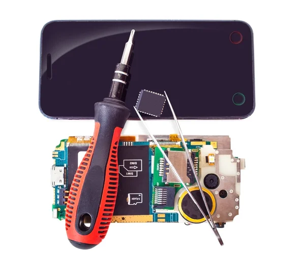 Eszközök és a szétszerelt telefon — Stock Fotó