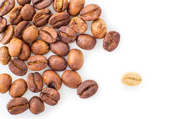 Roasted coffee beans strewn — Stock Photo, Image