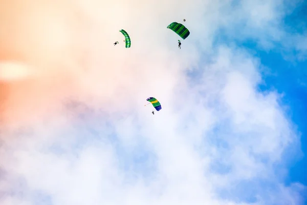 Three athletes parachutist fly — Stock Photo, Image