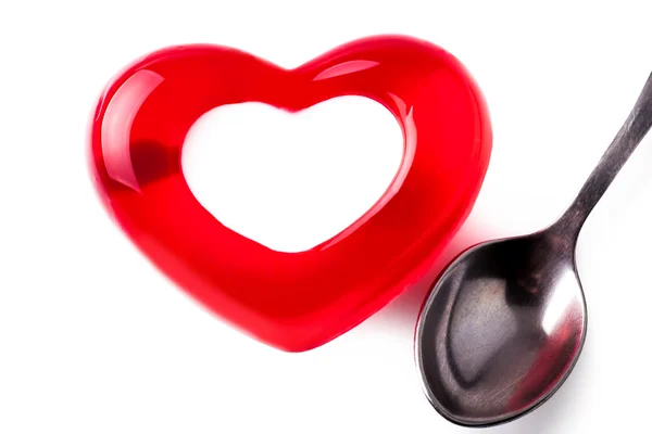 Jelly in the form of heart with a spoon — Stock Photo, Image