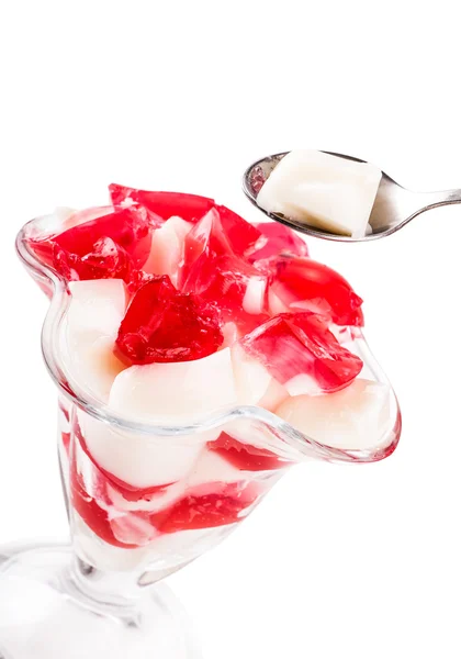 Vanilla and red jelly in a glass goblet — Stock Photo, Image