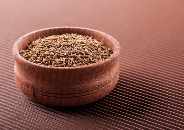 Cumin in a wooden bowl — Stock Photo, Image
