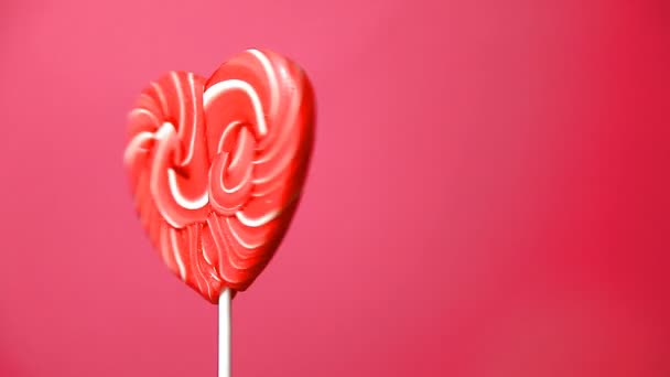 Lollipop in the form of a heart — Stock Video