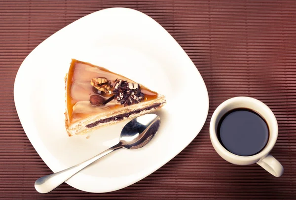 Walnut cake and a cup of coffee — Stock Photo, Image