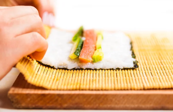 Chef turns nori sheet — Stock Photo, Image