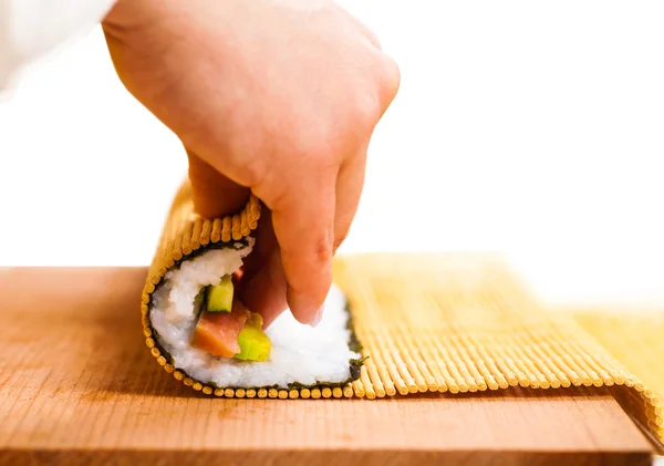 Hand turns nori — Stock Photo, Image