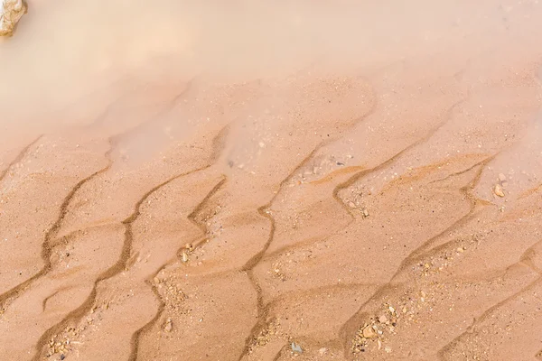 Textur aus nassem Sand und Wasser Nahaufnahme — Stockfoto