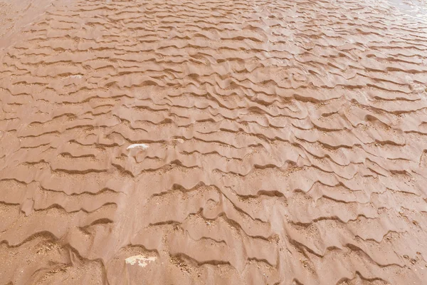 Textuur van natte zand close-up — Stockfoto