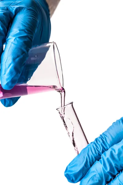 Worker reagent pouring into the flask — Stock Photo, Image