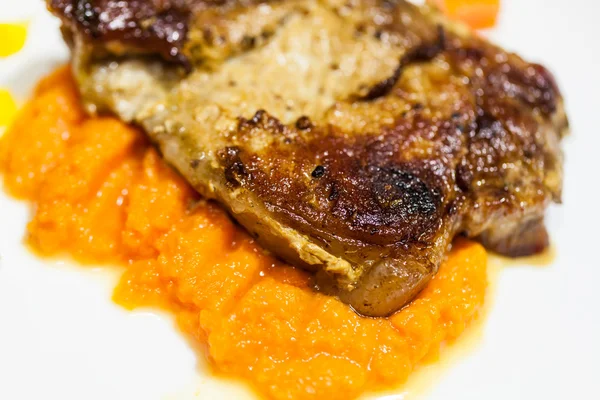 grilled meat with pumpkin puree