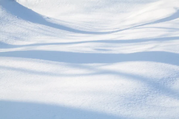 Snow-covered land closeup winter day — Stock Photo, Image