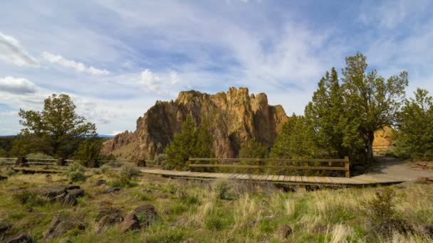 Time Lapse Movie of Moving White Clouds Blue Sky and Rock Climbing Over Smith Rock in Central Oregon 1080p — Stock Video
