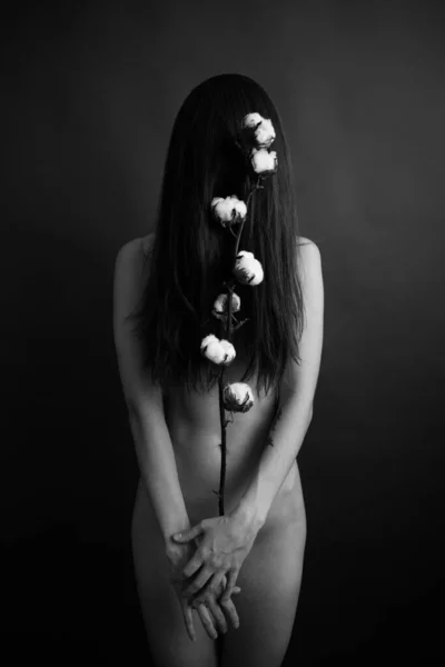 girl and cotton branch, black and white art photo of body parts and plants