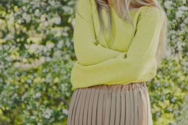 spring photo shoot in nature, beautiful girl walking in the park on a sunny day, close-up details