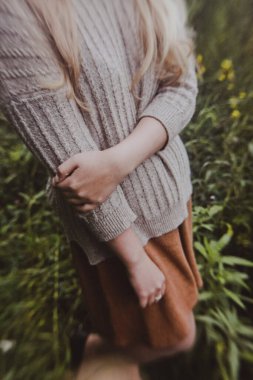 spring photo shoot in nature, beautiful girl walking in the park on a sunny day, close-up details