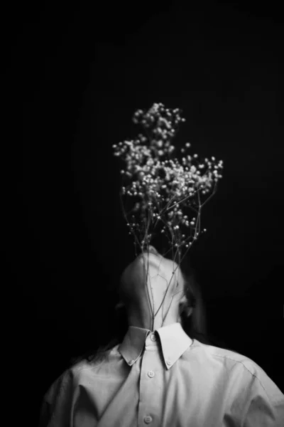 People and dry plants. Minimalistic black and white portrait of a girl and a herbarium. Space for text