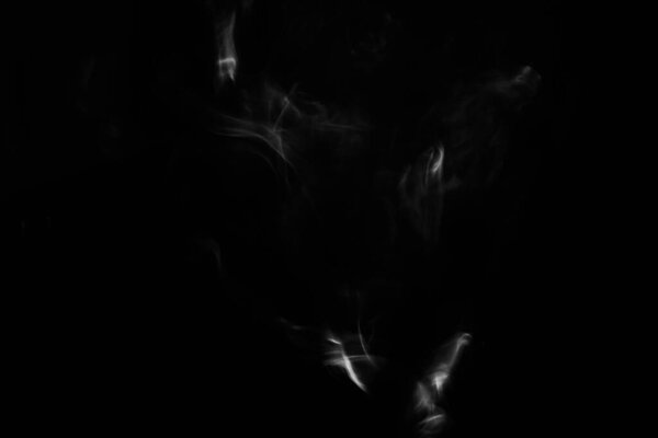 Black and white photo of smoke puffs, beautiful patterns from cigarettes and hookah close-up