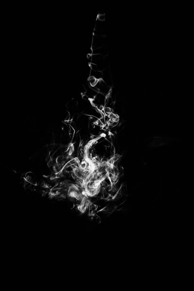 Black and white photo of smoke puffs, beautiful patterns from cigarettes and hookah close-up