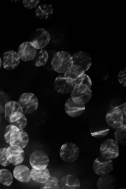 Siyah beyaz çelenk, parlak soyut arkaplan