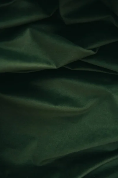 green suede texture, velvet texture in green shades, beautiful close-up curtains