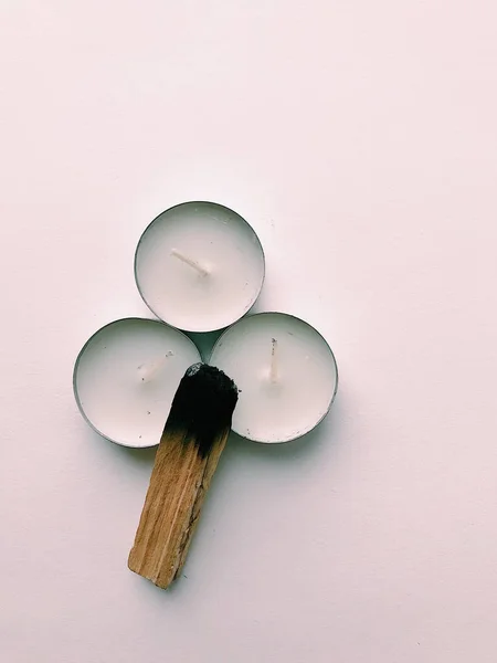 Natural incense White Sage and Palo Santo. Sacred tree of South America, color square photo.White Sage and Palo Santo on white background.