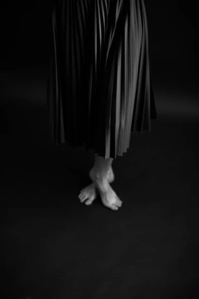 beautiful female legs, black and white portrait of human body parts, fuzzy and noisy film photography, art and fashion