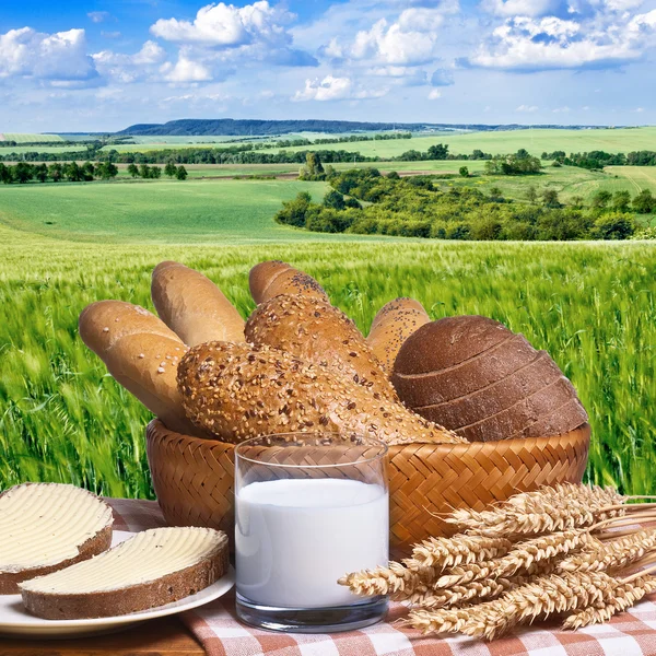 Still life with bread buns and glass of milk — Stock Photo, Image