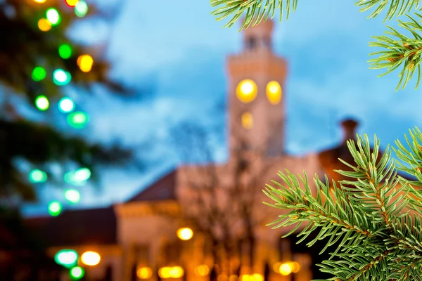 Christmas background with old town hall and christmas twig — Stock Photo, Image