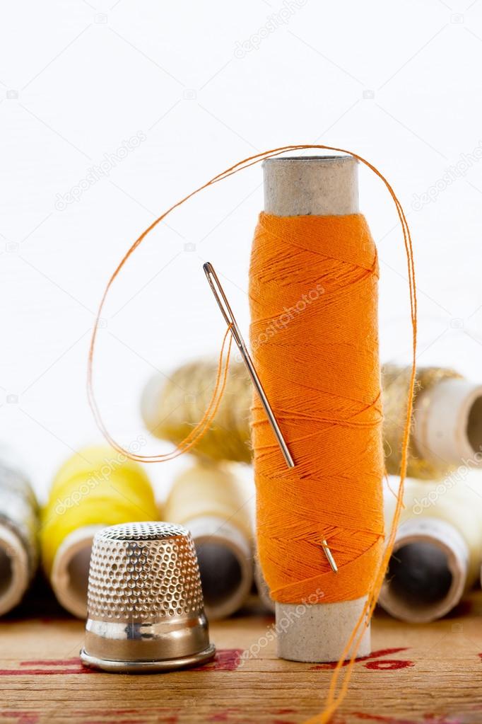 nedle with orange color thread