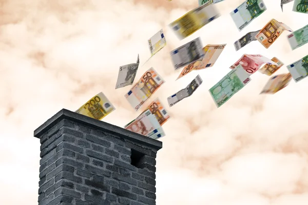 Euro money flies up the chimney — Stock Photo, Image