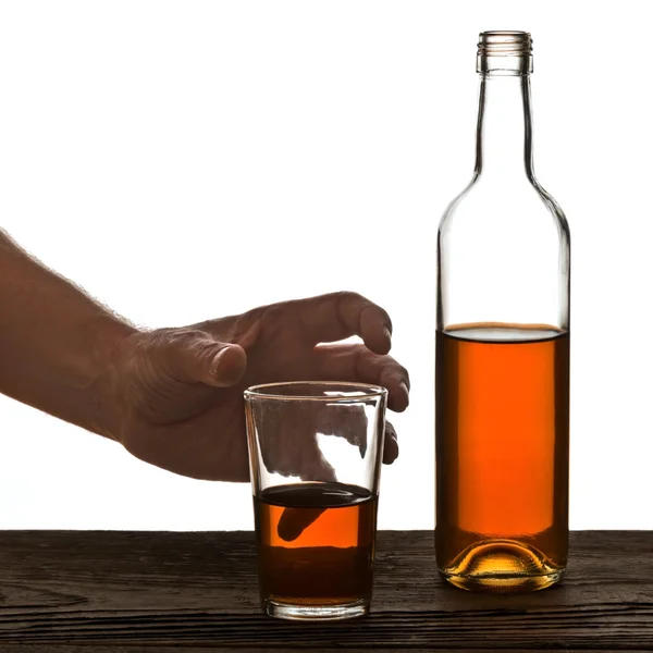 Glas en fles voor brandy geïsoleerd op de witte — Stockfoto