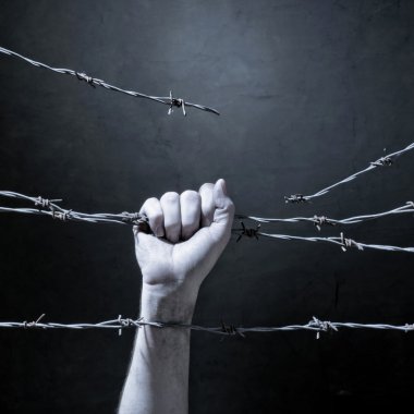 hand behind barbed wire clipart