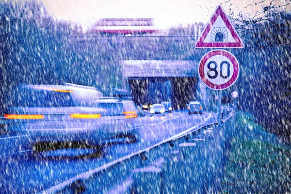 A road with tunnel in the snow fal — Stock Photo, Image