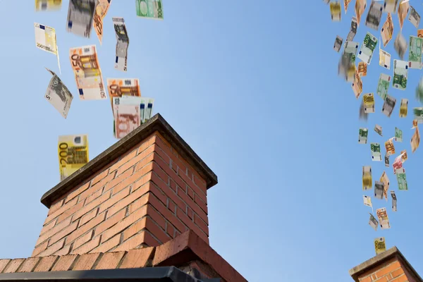 Euro money flies up the chimneys — Stock Photo, Image