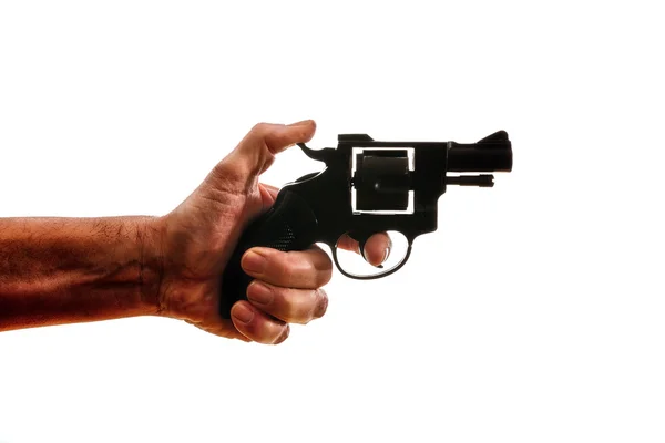 Σιλουέτα του ένα επανδρώνει το χέρι με ένα πιστόλι — Φωτογραφία Αρχείου