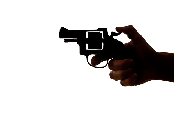 Silhouette of a mans hand with a handgun — Stock Photo, Image