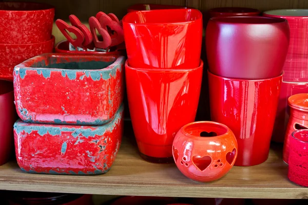 Red flowerpots in the florist store — Stock Photo, Image